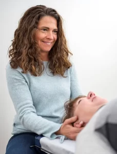 Chiropractor Shorewood WI Monica Maroney Adjusting Patient