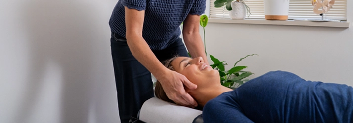 Patient with neck pain receiving a chiropractic adjustment